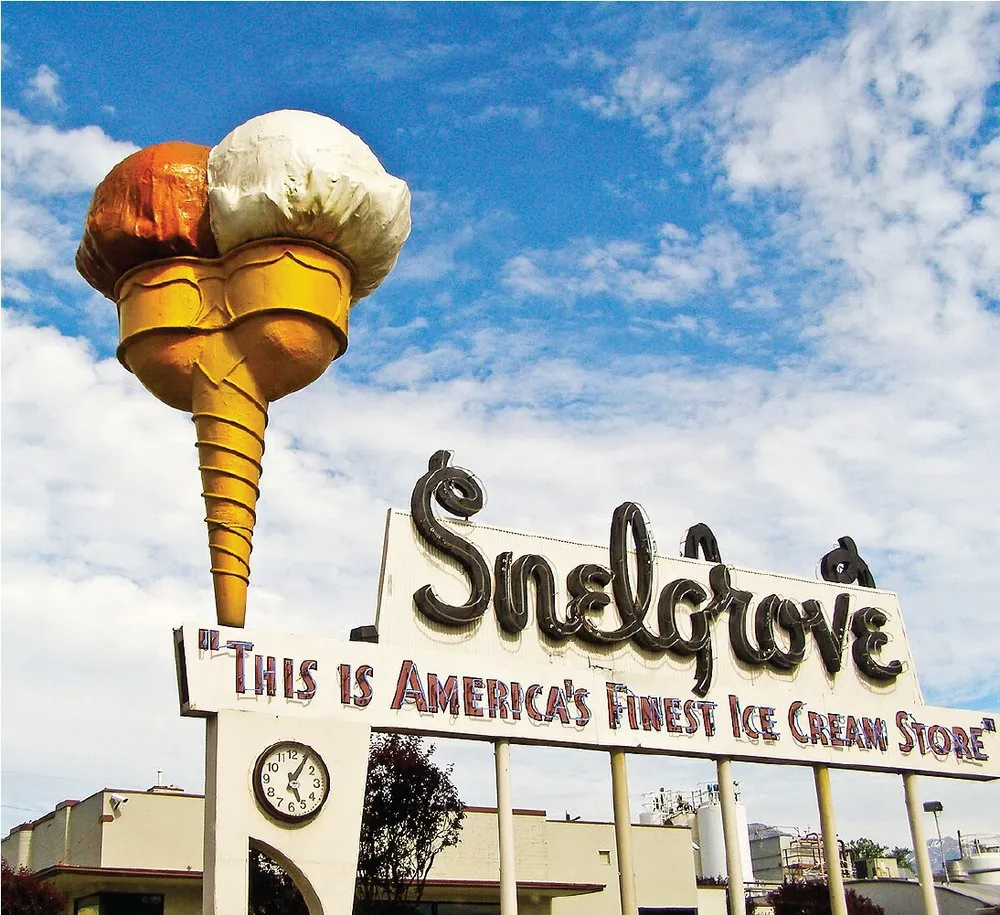Historic Snelgrove Ice Cream storefront with the iconic double cone neon sign